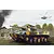 Box art illustration of a BMD-3 airborne infantry fighting vehicle in camouflage, with a helicopter in the background and a damaged building.
