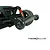 A T-Bone Racing wheelie bar installed on the rear of an ARRMA Kraton RC truck, featuring two black wheels on a black plastic mount.
