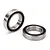 Two Traxxas rubber-shielded ball bearings shown on a white background, one standing upright and one lying flat.