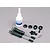 Traxxas PTFE-coated aluminium shock absorber set including two shocks, silicone oil, and various small plastic and metal mounting hardware components.