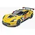 A fully assembled and painted 1/25 scale Revell Corvette C7.R model race car in yellow with racing decals on a white background.