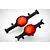 Two black RC axle housings with bright red circular differential covers, viewed from an elevated angle against a white background.