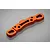 An orange anodized aluminium suspension arm pin mount for an RC car, shown from an angled top-down perspective on a grey background.