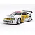 A Tamiya 1/10 scale RC Opel Calibra V6 touring car model with white, yellow, and black racing livery on a plain white background.