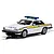A 1/32 scale Scalextric Jaguar XJS police car model in white with blue and yellow livery, featuring a roof-mounted light bar and County Constabulary markings.