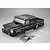 A black painted 1/10 scale RC crawler body shell by Killerbody, shown with included decal sheets and small plastic accessory parts on a grey background.
