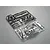 Two plastic model parts trees for a 1/10 scale Nissan Skyline R34, one in black and one in chrome finish, on a grey background.