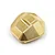 A brass differential cover for an RC car with a faceted design and the Yeah Racing logo engraved on the top.