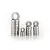 A collection of various sized metal ball bearings stacked in four groups against a white background.