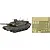 A 1/72 scale model of a JGSDF Type 10 tank in camouflage paint next to a sheet of photo-etched metal detail parts.