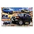 Fujimi 1/24 scale Toyota FJ Cruiser plastic model kit box featuring illustrations of the vehicle in blue, tan, and black on a rocky terrain background.