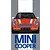 Front view of an orange Mini Cooper model kit box art featuring a white roof and racing stripes.
