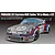 A studio render of a Fujimi 1/24 scale Porsche 911 Carrera RSR Turbo model car featuring the iconic silver and Martini Racing livery.