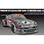 A studio illustration of a silver 1974 Porsche 911 Carrera RSR Turbo race car with Martini racing livery and number 9.