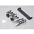 Black plastic RC car parts including a spoiler, light buckets, and trim pieces on a grey background.