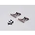 Two grey aluminium RC rear wing mounts with a set of small black screws on a plain light grey background.