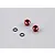 Two red aluminium LED light holders and two black rubber O-rings on a grey background.