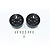 Two black 7-spoke aluminium beadlock rims for RC crawlers with a set of small mounting screws, set against a white background.