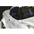 A close-up view of a black racing-style side mirror mounted on a white RC drift car body.