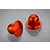 Two orange anodized aluminium RC body shell posts with a rounded top and side hole, displayed on a reflective grey surface.