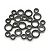 A collection of various sized metal ball bearings with black rubber seals arranged on a white background.
