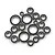 A collection of various sized metal ball bearings with black rubber seals arranged on a white background.