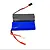 A 7.4V 1200mAh Li-Ion battery pack for RC vehicles, featuring a blue shrink-wrapped section and a black and silver checkered section with wires and connectors.