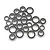 A collection of various sized metal ball bearings with black rubber seals, arranged in a pile on a white background.