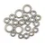 A collection of various sizes of metal shielded ball bearings arranged on a white background.