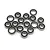 A collection of small metal ball bearings with black rubber seals scattered on a white background.