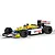 A 1/32 scale Scalextric model of the Williams FW11 Formula 1 car driven by Nigel Mansell, featuring the iconic yellow, blue, and white Canon livery.