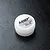 A small white plastic container of MST Ball Differential Grease, model 130040, sitting on a black textured surface.
