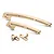 A set of gold-anodized aluminium RC chassis braces and mounting brackets on a white background.