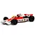 A 1/32 scale Scalextric McLaren M23 slot car in red and white livery with number 29, featuring a driver figure and Goodyear branding.