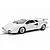 A white Scalextric 1/32 scale Lamborghini Countach slot car on a track against a white background.