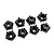 A set of eight black plastic Traxxas wheel hub adapters arranged on a white background.