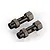 Two gunmetal grey aluminium front double axles for an RC car, shown from an elevated angle against a white background.