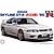Box art illustration of a white 1995 Nissan Skyline R33 GT-R model car, featuring the Fujimi logo and model name text.