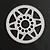 A white Delrin 110T 64dp spur gear for RC cars, featuring a spoked design and central mounting holes, set against a dark textured background.