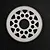 A white Delrin 82T 64dp spur gear for RC cars, featuring a circular design with weight-reduction holes, centered on a black background.