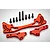 A set of red anodized aluminium RC car parts including a large shock brace and two smaller mounting plates with eight black steel screws.