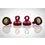 Four red anodized aluminium shock caps with green rubber seals, arranged on a white reflective surface.