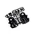 A black plastic Tamiya D parts sprue containing various RC car components, including gear covers and small circular parts, on a white background.