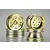 Four gold-plated RC buggy rims from Tamiya, featuring a classic multi-hole design, arranged in two stacks against a light grey background.