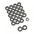 A collection of small metal ball bearings with black rubber seals arranged on a white background.