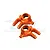 Two orange anodized aluminium steering hubs for RC cars, shown from a top-down perspective against a white background.