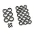 A collection of various sized rubber shielded ball bearings arranged on a white background.