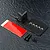 MST black aluminium rear ESC mount kit including a metal bracket, carbon fiber plate, double-sided tape, and various screws on a textured black surface.