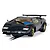 A 1/32 scale Scalextric Lamborghini Countach slot car in dark blue with gold wheels, positioned on a slot car track.