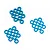 A collection of blue anodized aluminium flat washers arranged in three small groups against a white background.